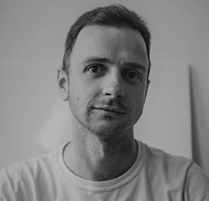 black and white image of Dirk wearing a white tee shirt