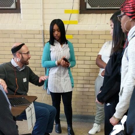 David Waxler demonstrates electroencephalography (EEG) for Bodine High School students