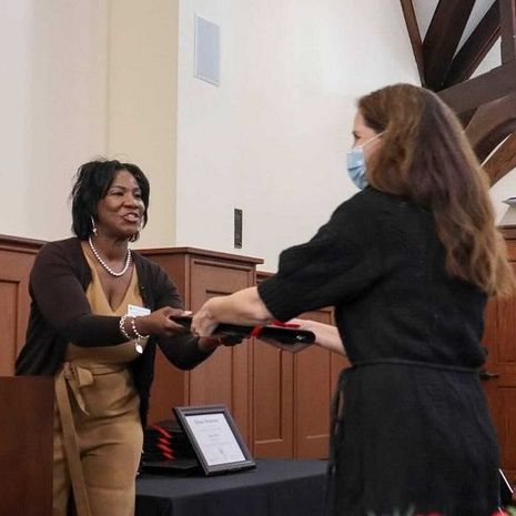 image of faculty member receiving their award from Faye Richardson