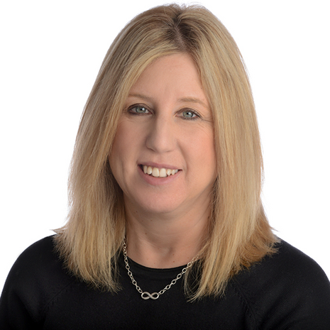 image of cindy wearing a black top smiling at the camera against a white background