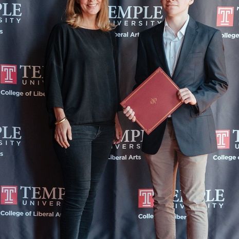 Senior philosophy major Alexander Drusda stands with faculty member Kristin Gjesdal