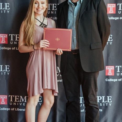 Senior philosophy major Alexandra Van der Gaag stands with faculty member Paul Crowe