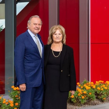 Leonard and Helena Mazur standing in the College of Liberal Arts