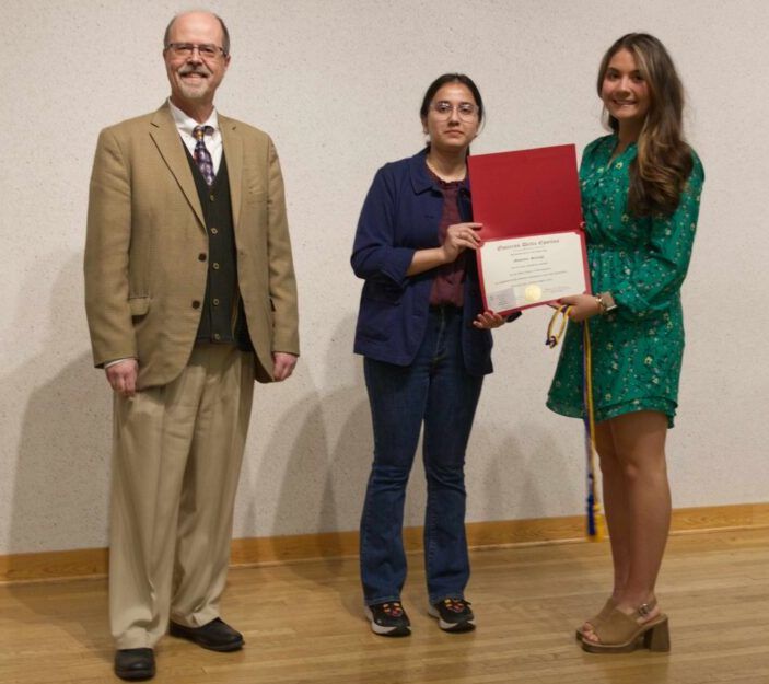 Professor Diamantaras and ODE President Zainab Malik with new initiate Madelyn Sayegh