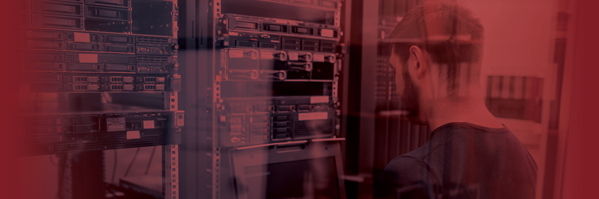 image of a man standing at a set of computer servers