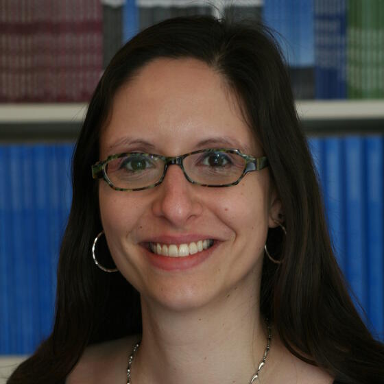Elise Chor in a black shirt smiling and staring into the camera
