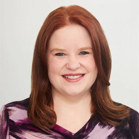 Julie Booth smiling and staring into the camera