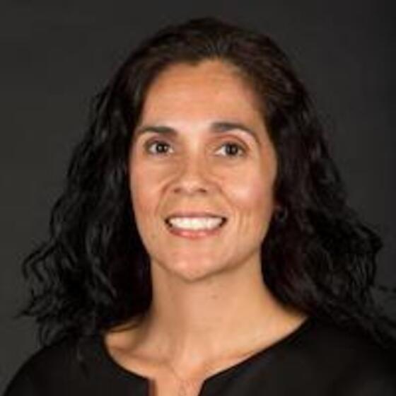 Sandra Sepulveda-Kozakowski smiling and staring into the camera