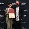 image of LAURA student and Professor Steve Windisch standing informs of a backdrop