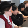 image of students sitting at a desk in an IH class