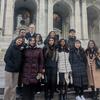 image of students and dean standing in from of the NY Public Library