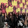 image of Sonkin students standing in from of an art piece