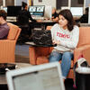 image of student on her computer in the tech center
