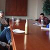 image of students and faculty memeber talking at a table