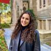 Sussan smiling on the Temple campus. 