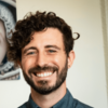 image of Vlad wearing a blue shirt and smiling at the camera