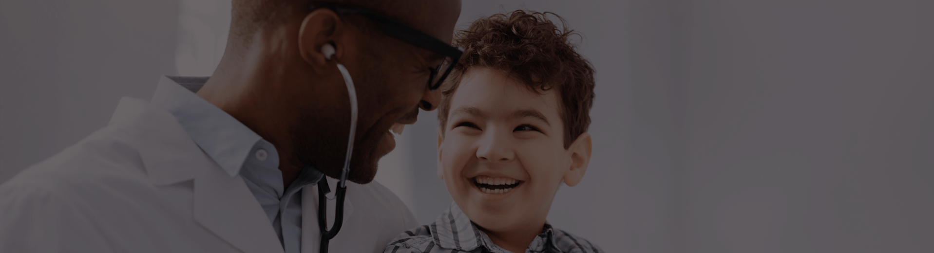 photo of doctor caring for child patient
