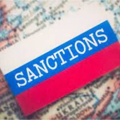image of the word Sanction written in white on a striped red, white and blue background