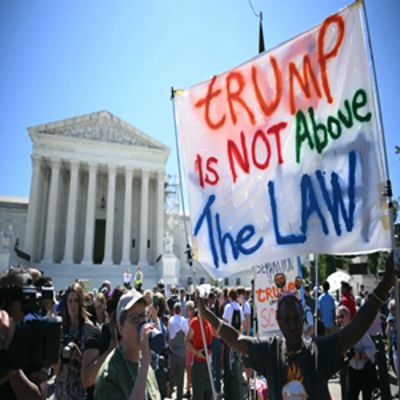 image of protesters at the white house holding up megaphones and a sign that says Trump is not above the law