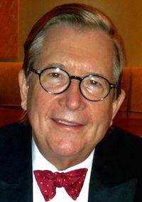 image of Lacy Hunt in a red bowtie, wearing glasses