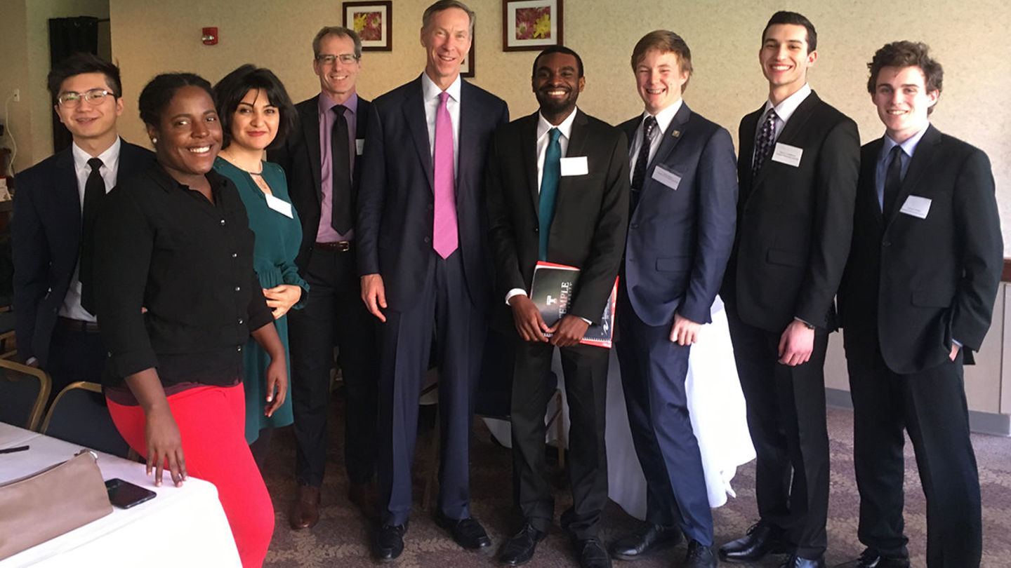 Vanguard CEO F. William McNabb with Dean of the College of Liberal Arts Dr. Richard Deeg and a group of Economics students