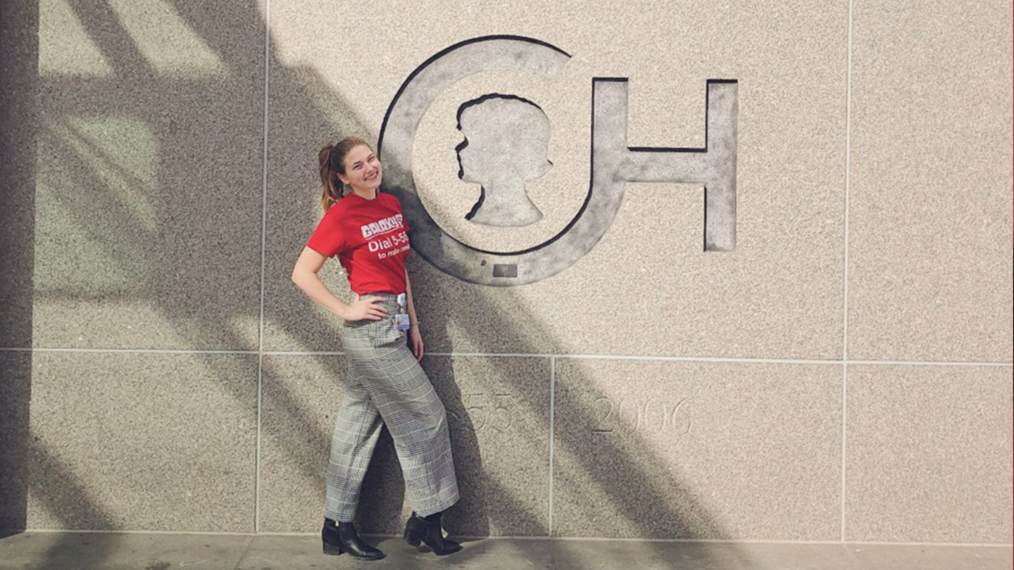 Casey Genett, CLA '20, next to a Children's Hospital of Philadelphia building