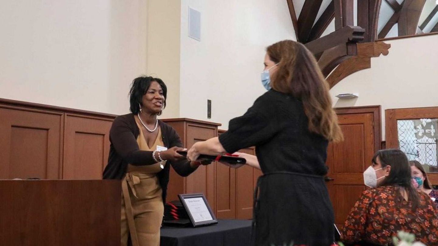 image of faculty member receiving their award from Faye Richardson
