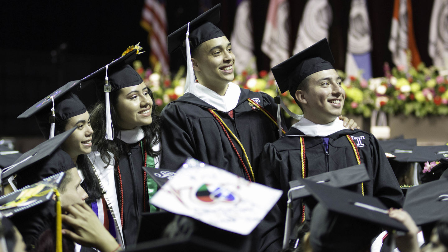 image of CLA students in their graduation caps and gowns