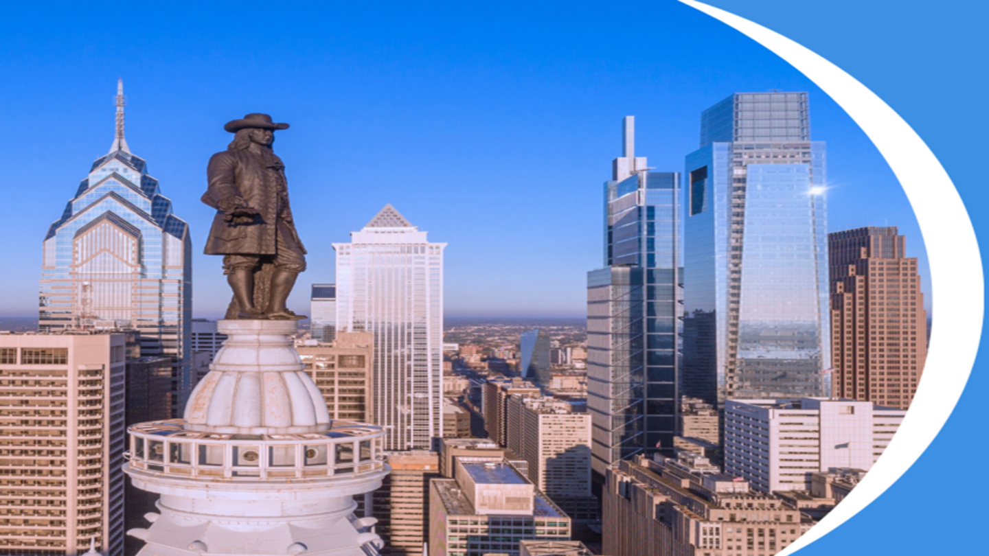 image of Ben Franklin on top of City Hall with the city of Philadelphia in the background on a blue background