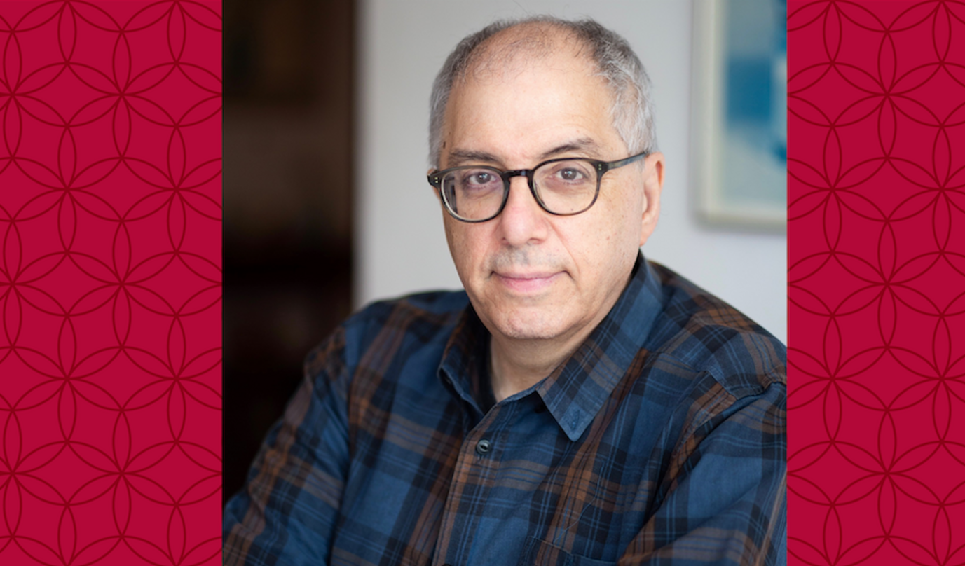 image of Steve wearing glasses and a plaid shirt smiling at the camera